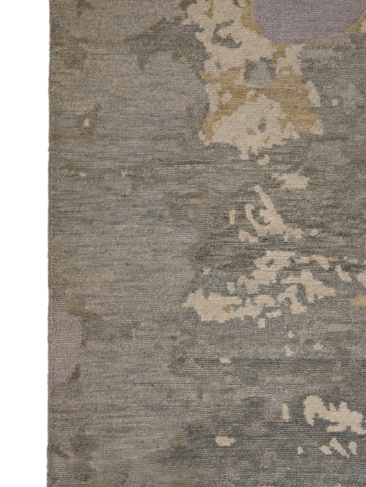 A hand-knotted wool and silk rug featuring a coastal aesthetic with serene coastal tones.