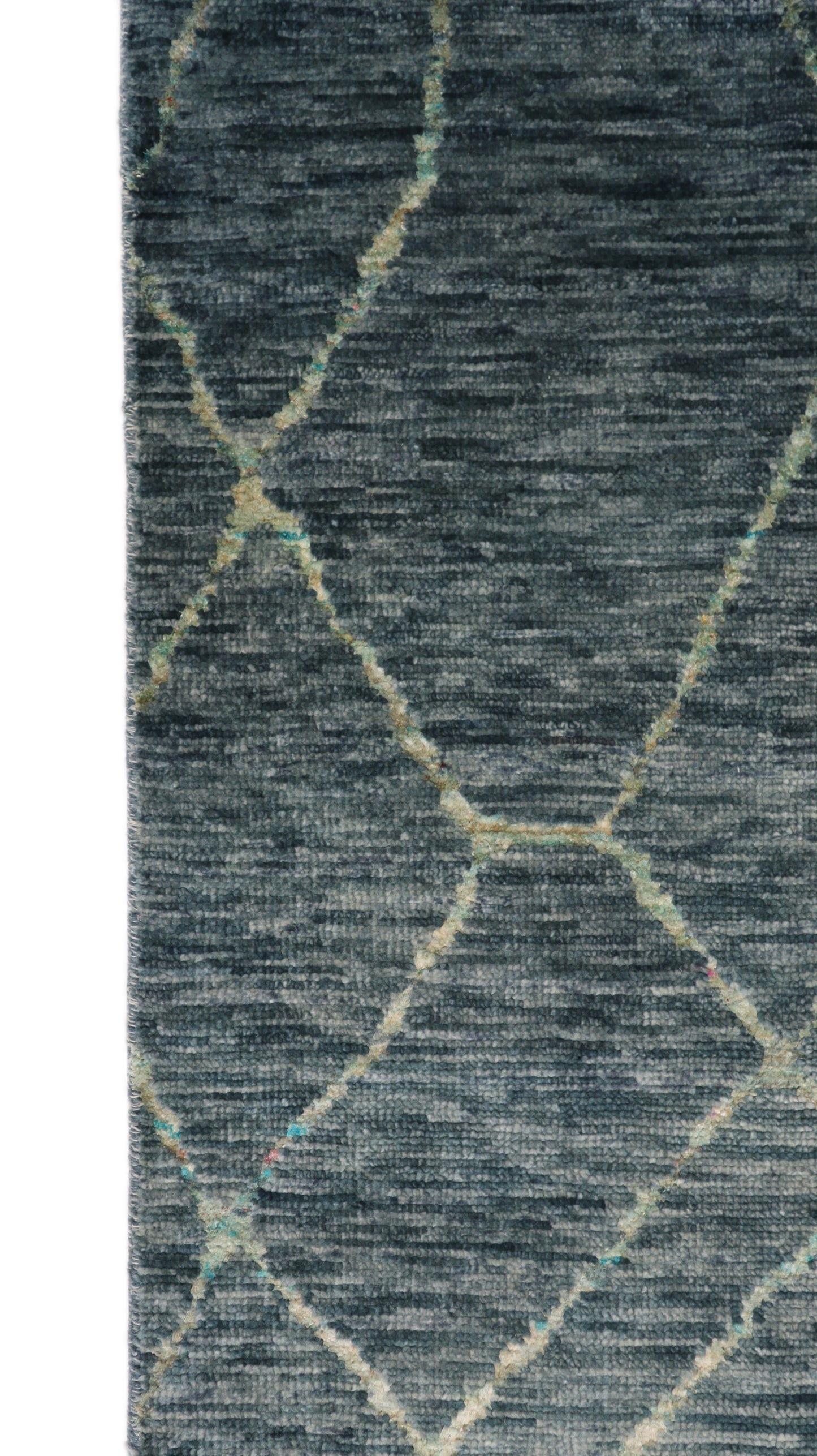 Handmade wool and recycled sari silk rug with a deep plush pile in ocean gray and blue with vibrant sea glass accents