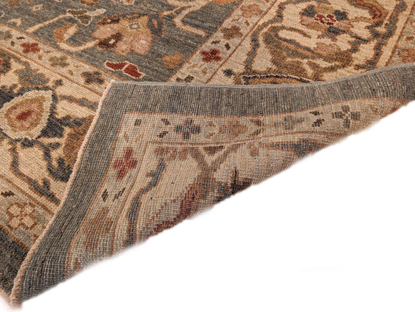 A hand-knotted wool rug with a traditional and contemporary design, featuring a luxurious color scheme of slate grey, red, gold, pink, blue, green, and beige. Low pile.