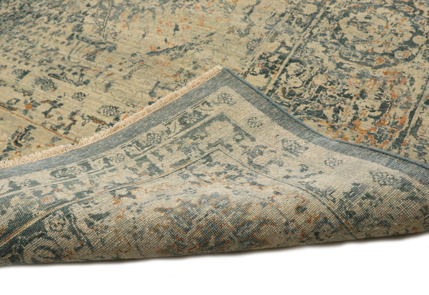 Hand- knotted decorative rug with a floral pattern in blue and beige tones