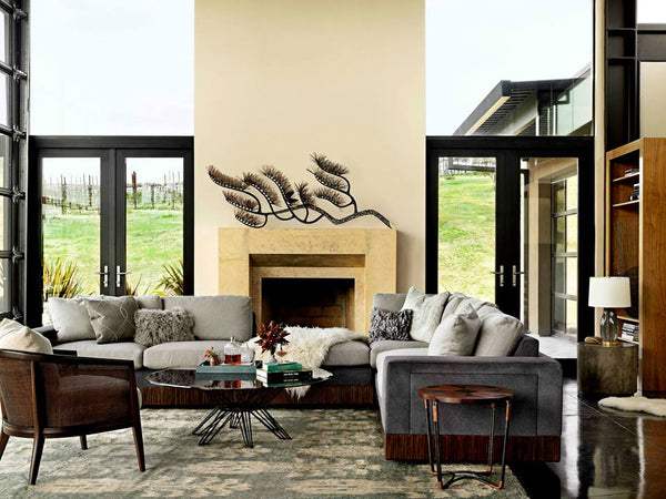 Modern living room with gray sofa, wooden coffee table, and decorative elements. The space is anchored by a cozy rug that perfectly unifies the décor.