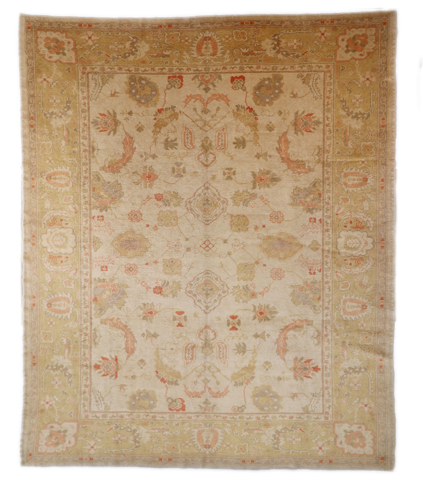 Hand-knotted mohair rug with a large knot and antique finish in oyster shell and sandy beige with dune grass green, rosehip pink, and gold accents.