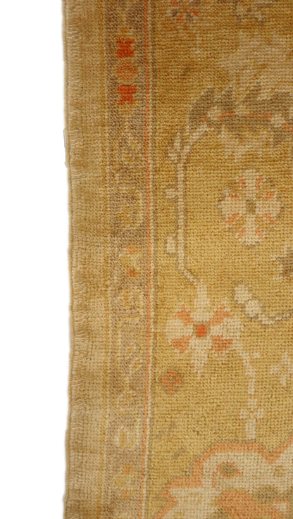 Hand-knotted mohair rug with a large knot and antique finish in oyster shell and sandy beige with dune grass green, rosehip pink, and gold accents.
