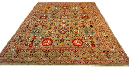 Hand-knotted wool rug with a weathered gray base and vibrant accents of sea glass blue, soft pink, purple, and gold.