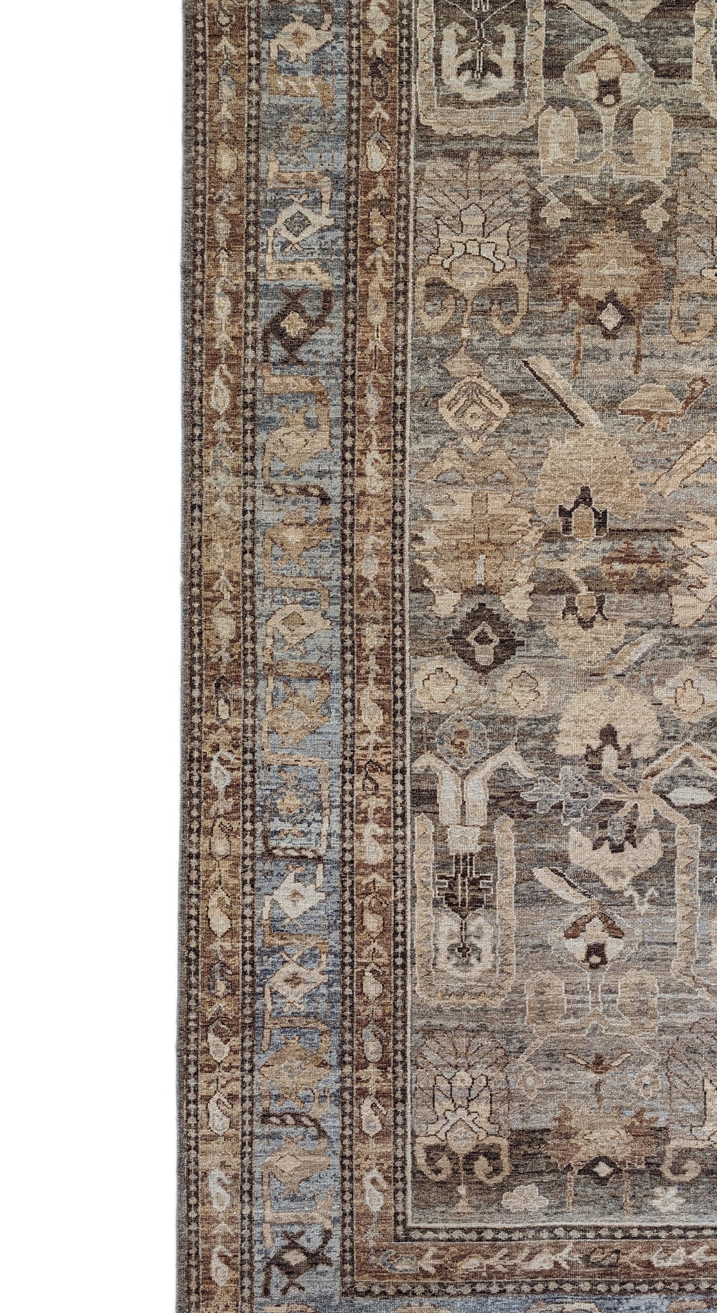 A hand-knotted wool rug with a geometric pattern in beige, blue, brown, and gold colors, showcasing a blend of traditional and contemporary design elements.