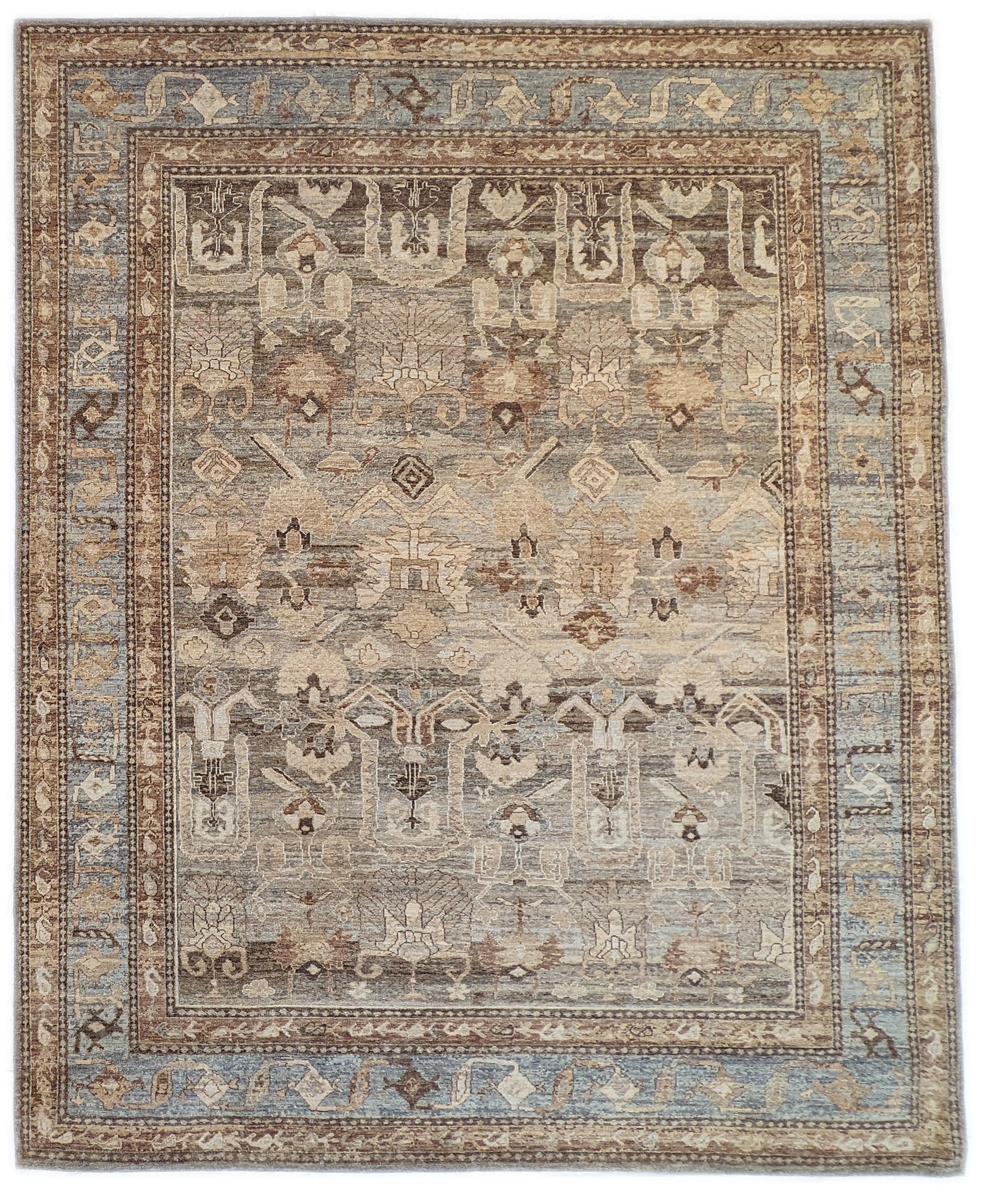 A hand-knotted wool rug with a geometric pattern in beige, blue, brown, and gold colors, showcasing a blend of traditional and contemporary design elements.