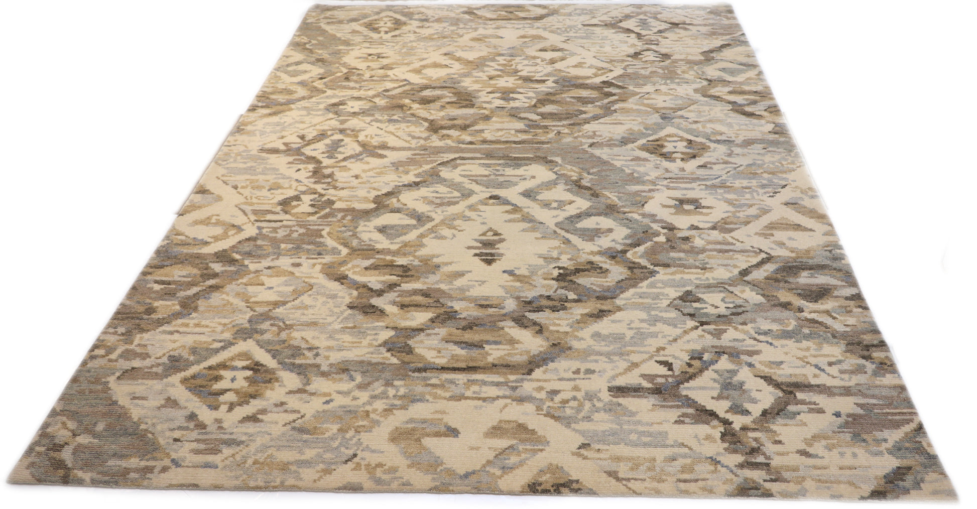 Hand- knotted patterned rug with geometric design in beige, brown, and gray tones. Cozy pile 