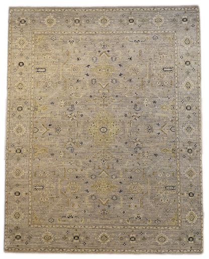 Hand-knotted wool rug with an antique finish in mist-gray, sand, and pale seagrass green with gold accents.