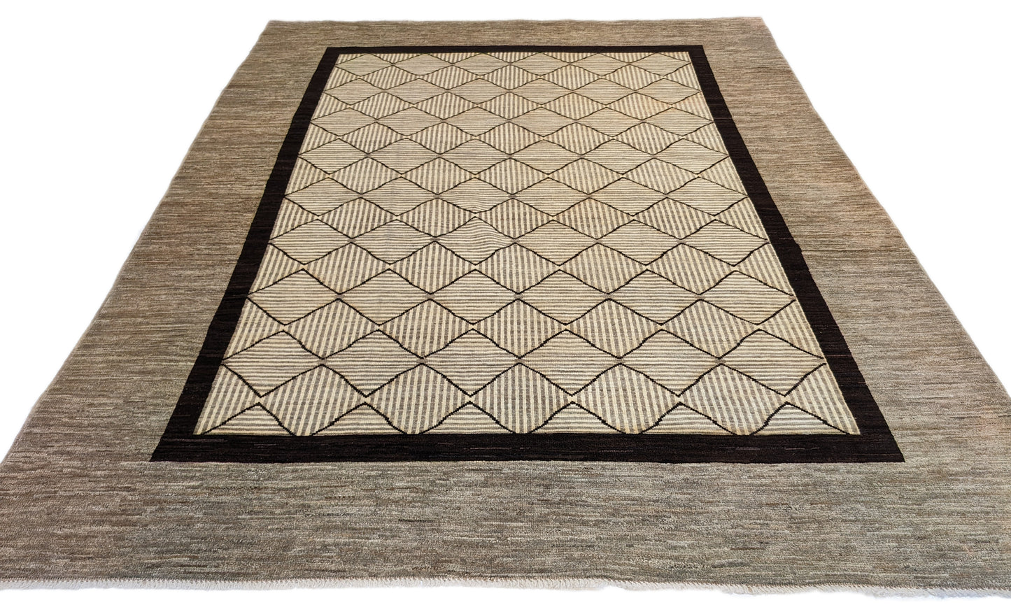 A hand-knotted wool rug with a geometric pattern in natural tones of beige, brown, and gray. Cozy pile. 