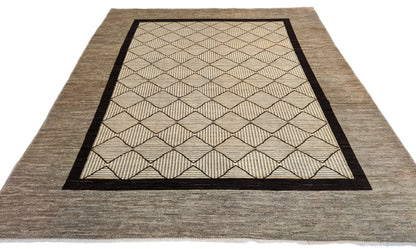 A hand-knotted wool rug with a geometric pattern in natural tones of beige, brown, and gray. Cozy pile. 
