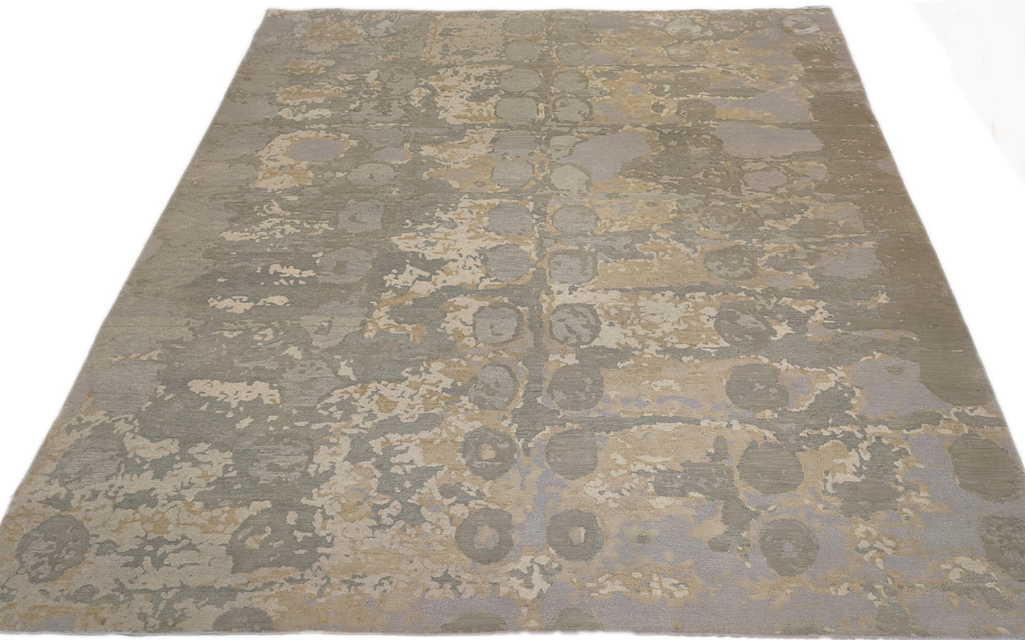 A hand-knotted wool and silk rug featuring a coastal aesthetic with serene coastal tones.