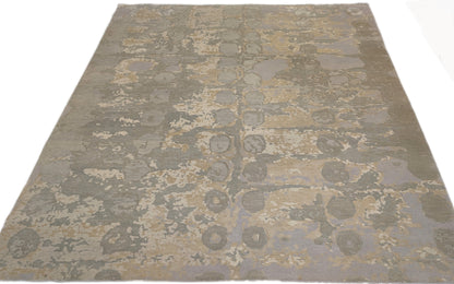 A hand-knotted wool and silk rug featuring a coastal aesthetic with serene coastal tones.