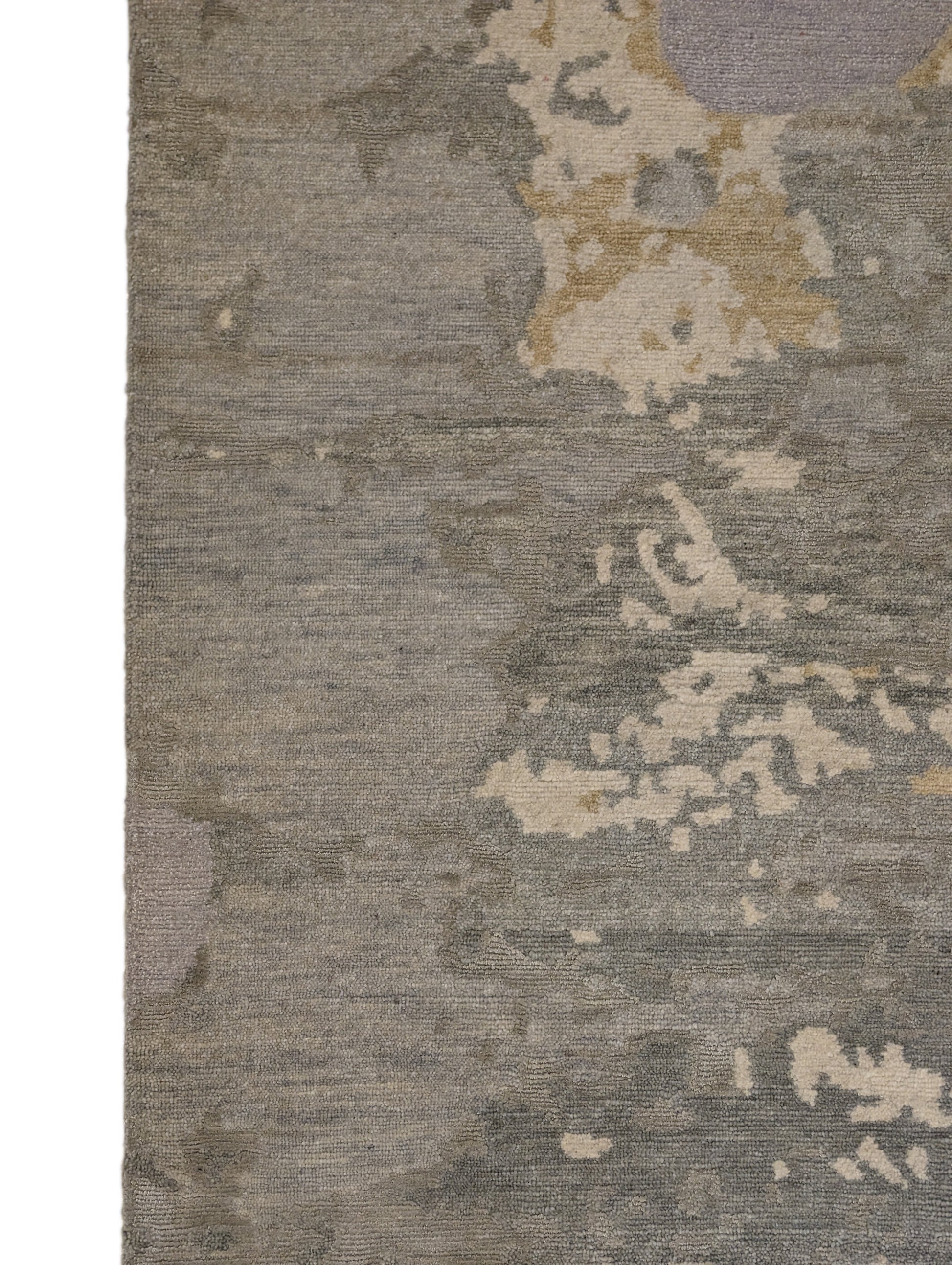 A hand-knotted wool and silk rug featuring a coastal aesthetic with serene coastal tones.