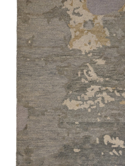 A hand-knotted wool and silk rug featuring a coastal aesthetic with serene coastal tones.