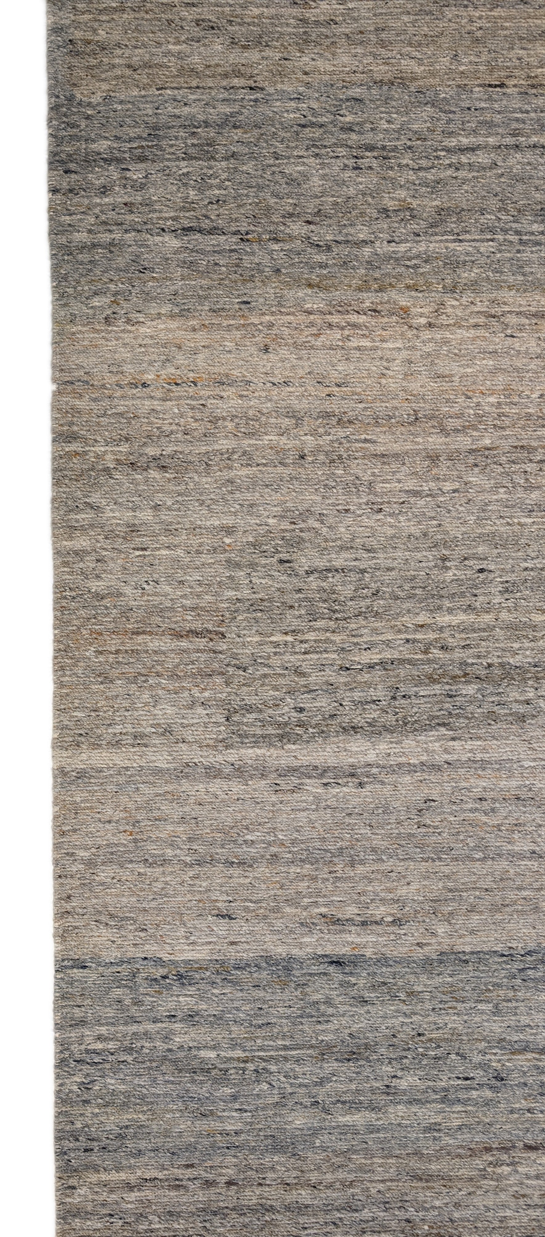 A hand-knotted wool rug with a coastal-inspired design in shades of light blue, beige, ivory, and brown. Cozy pile. 