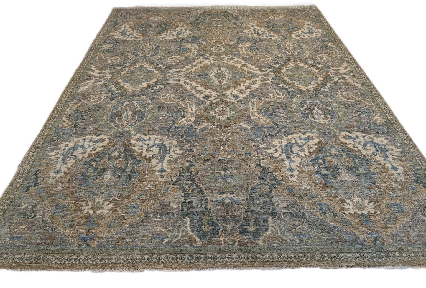 A hand-knotted wool rug featuring a traditional coastal lifestyle design with beige, blue, green, brown, gold, ivory, and grey colors.