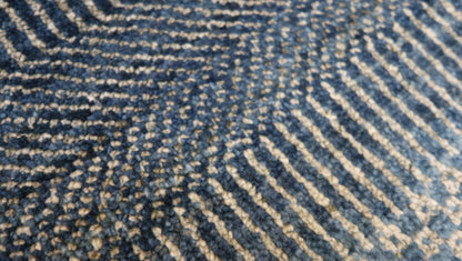Hand-knotted  sandy beige and blue wool rug with a subtle blue net pattern and a cozy pile.