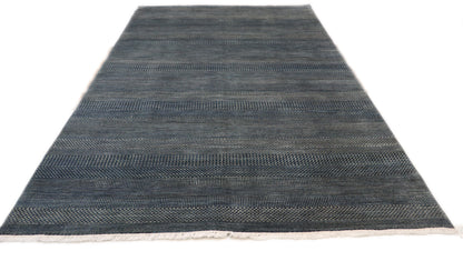 Hand-knotted  sandy beige and blue wool rug with a subtle blue net pattern and a cozy pile.
