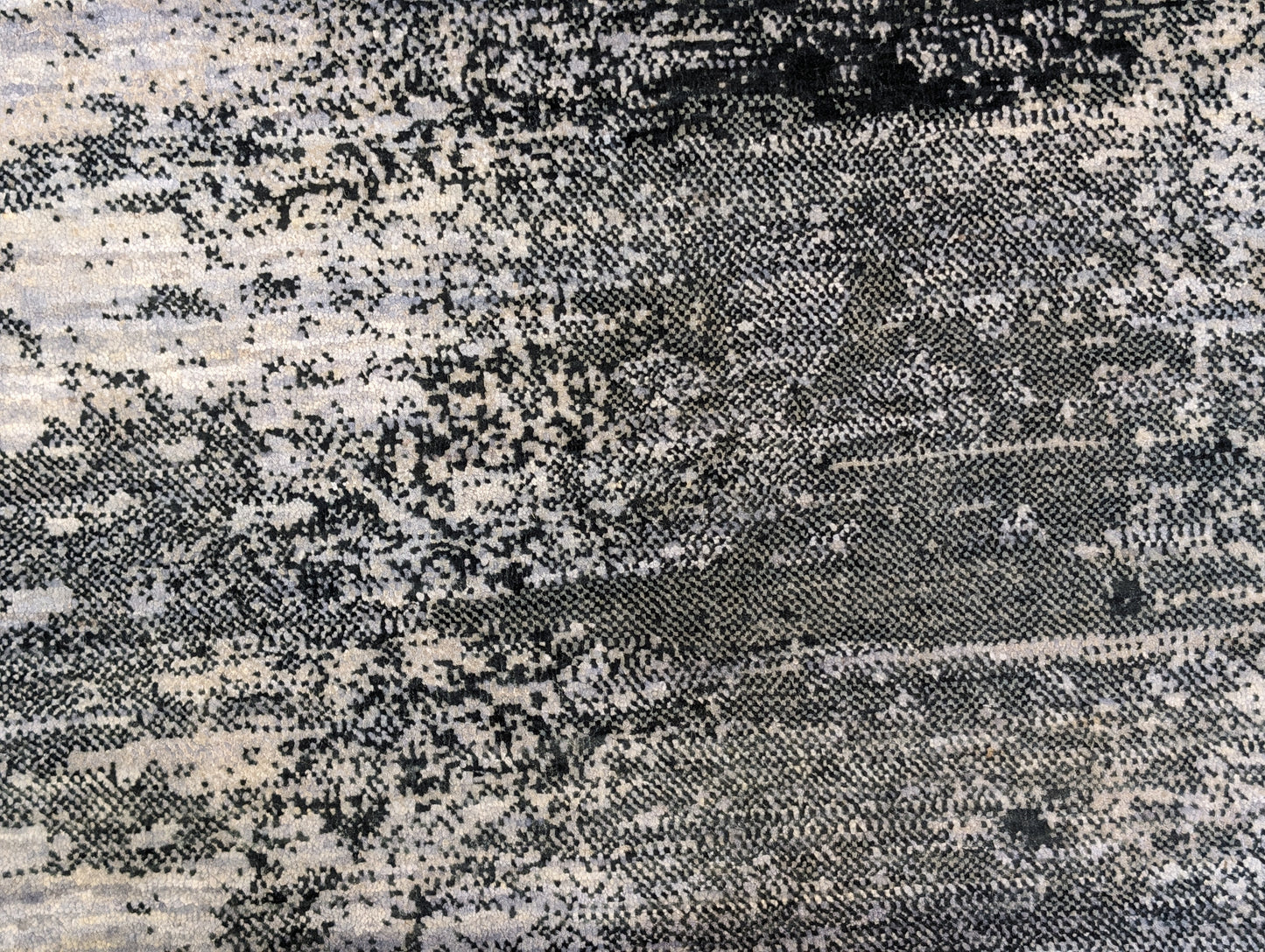 A hand-knotted rug with a serene coastal aesthetic featuring shades of gray, blue, and green, and a unique hand-knotted design. Cozy wool and luxurious silk. 