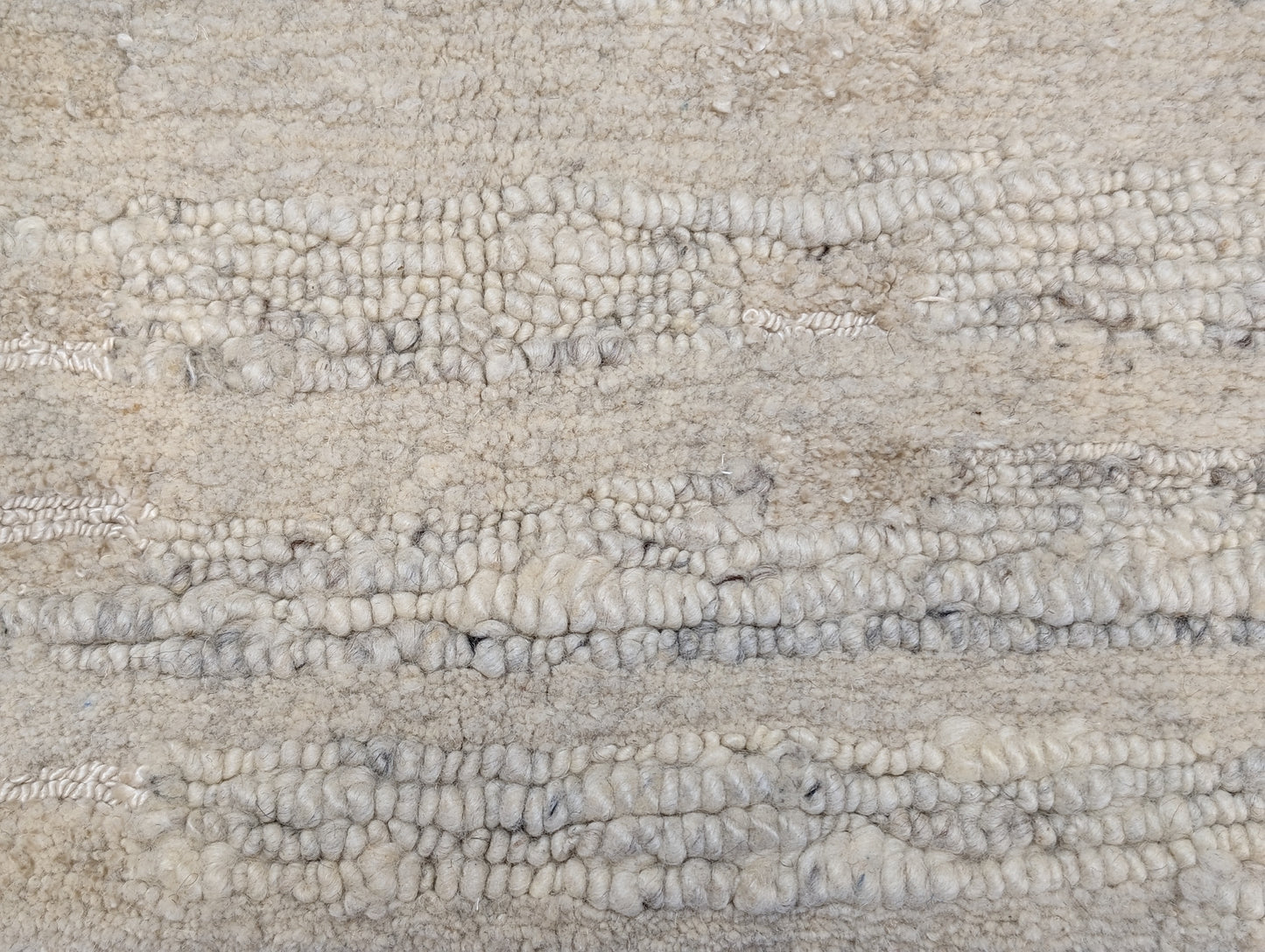 A beige hand-knotted rug with a coastal aesthetic from the Carmel-by-the-Sea Collection.
