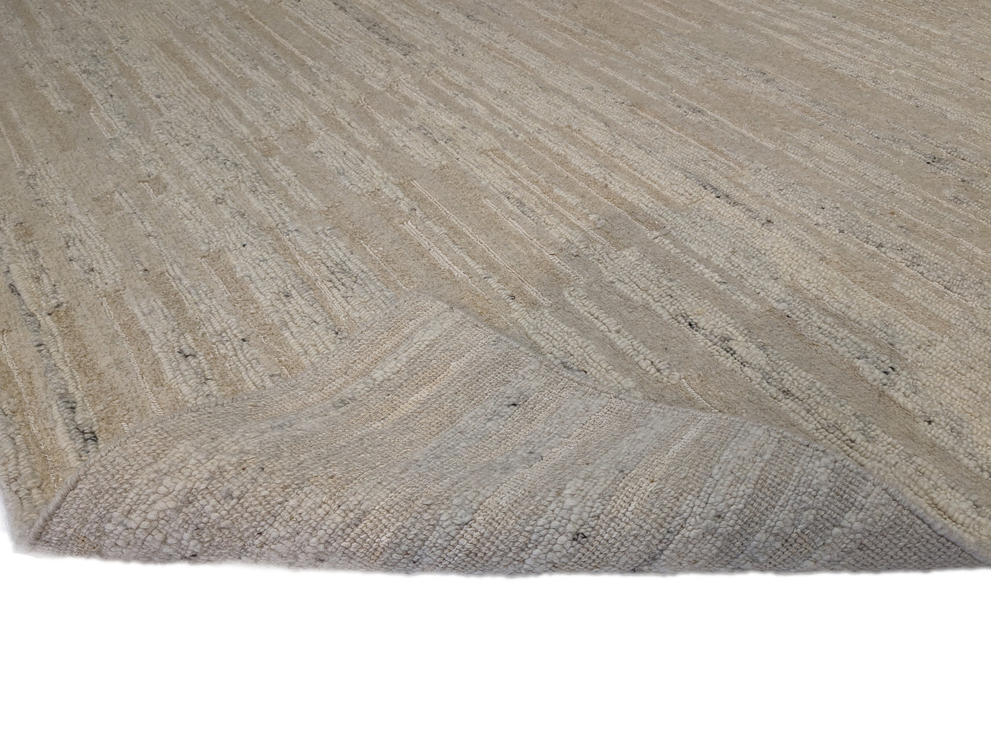 A beige hand-knotted rug with a coastal aesthetic from the Carmel-by-the-Sea Collection.