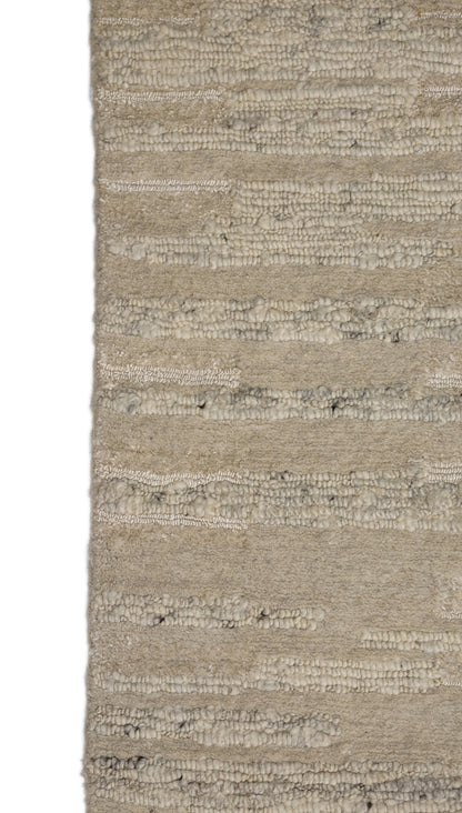 A beige hand-knotted rug with a coastal aesthetic from the Carmel-by-the-Sea Collection.