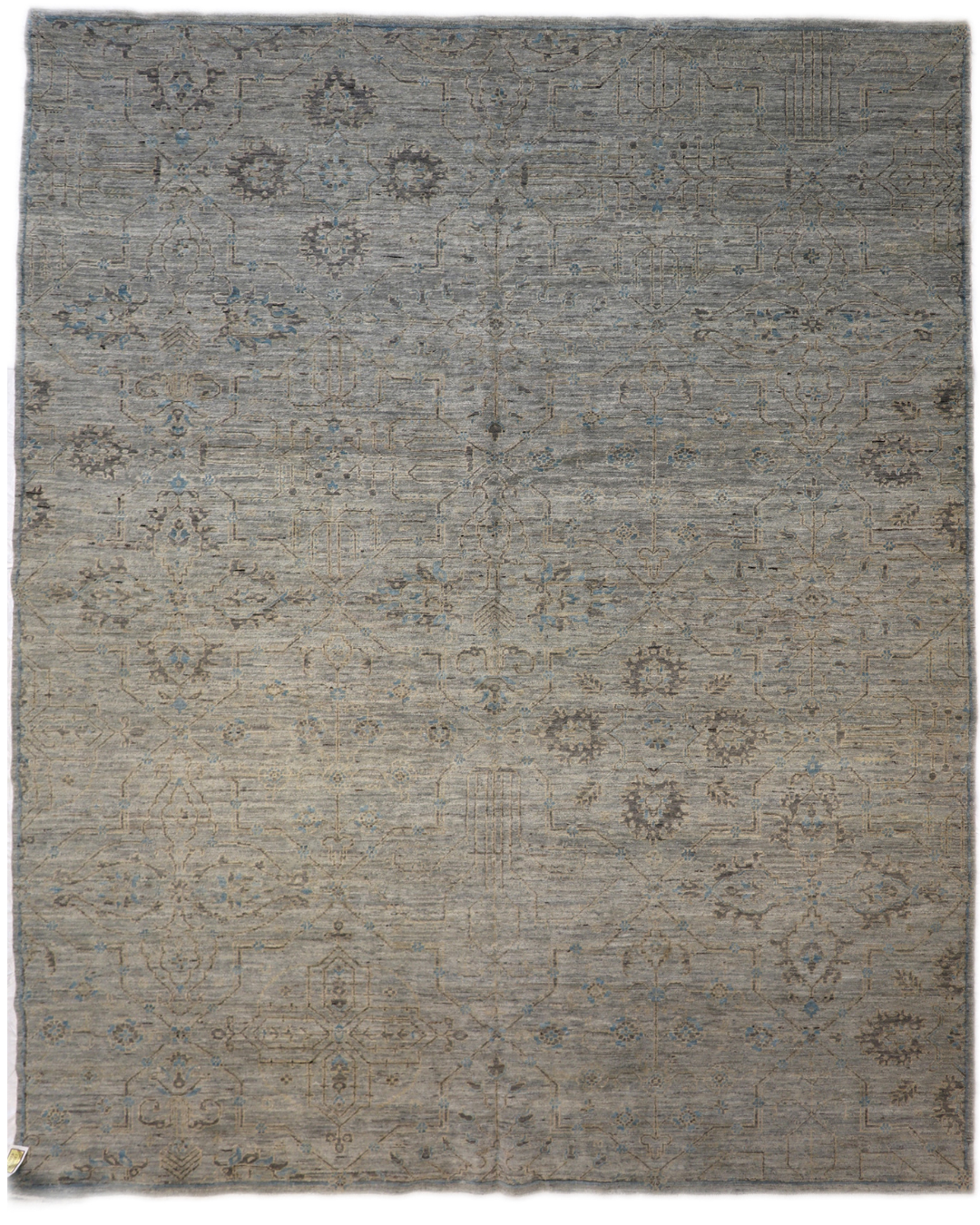 Hand-knotted rug in tranquil coastal shades of gray, smokey green, blue, soft yellow, and brown 