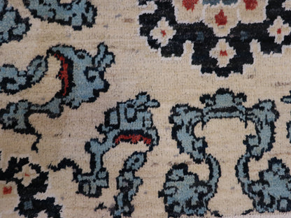 A hand-knotted rug with a coastal aesthetic, featuring a larger knot and higher pile. It has a vivid palette of turquoise, coral, and navy, with serene tones of ivory and white.