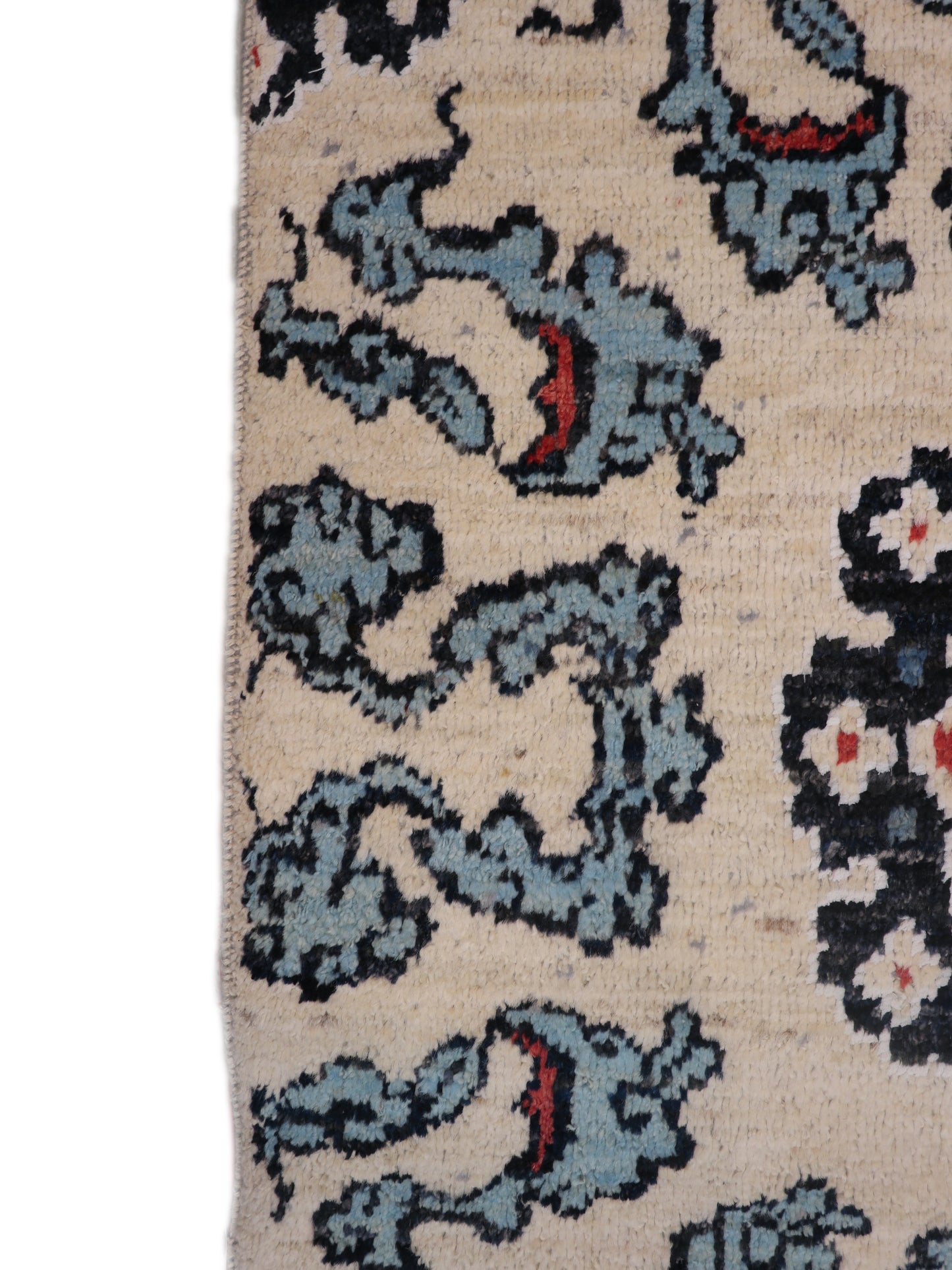 A hand-knotted rug with a coastal aesthetic, featuring a larger knot and higher pile. It has a vivid palette of turquoise, coral, and navy, with serene tones of ivory and white.