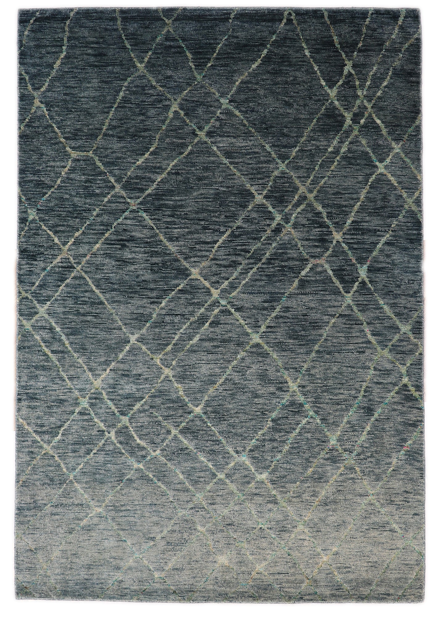 Handmade wool and recycled sari silk rug with a deep plush pile in ocean gray and blue with vibrant sea glass accents