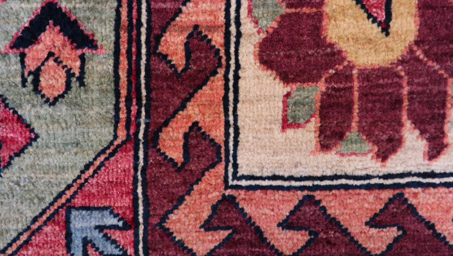 Hand-knotted decorative rug with intricate patterns and colors 