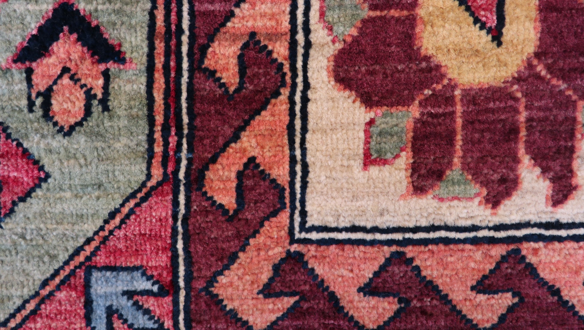 Hand-knotted decorative rug with intricate patterns and colors 