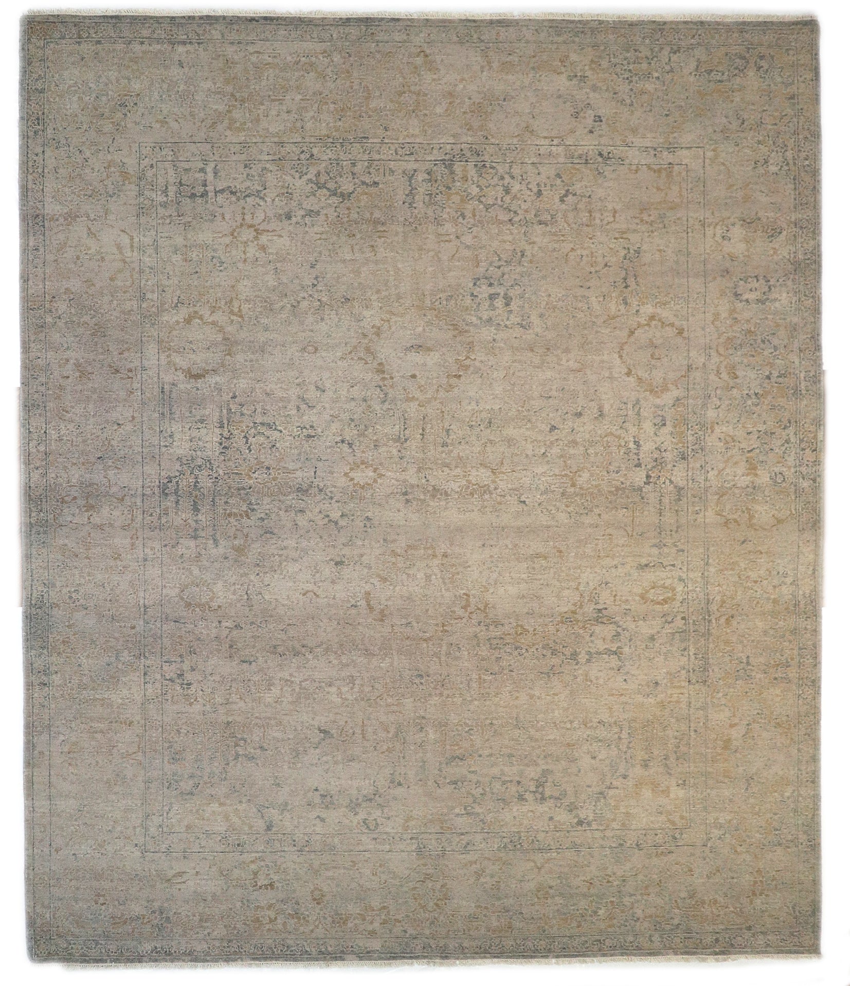 Hand-knotted wool rug with an antique finish in sun-bleached sand, seashell ivory, ocean blue, and driftwood gray.