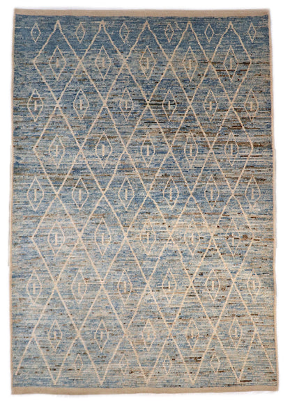 Hand-knotted blue and beige diamond patterned rug with a plush, cozy pile.