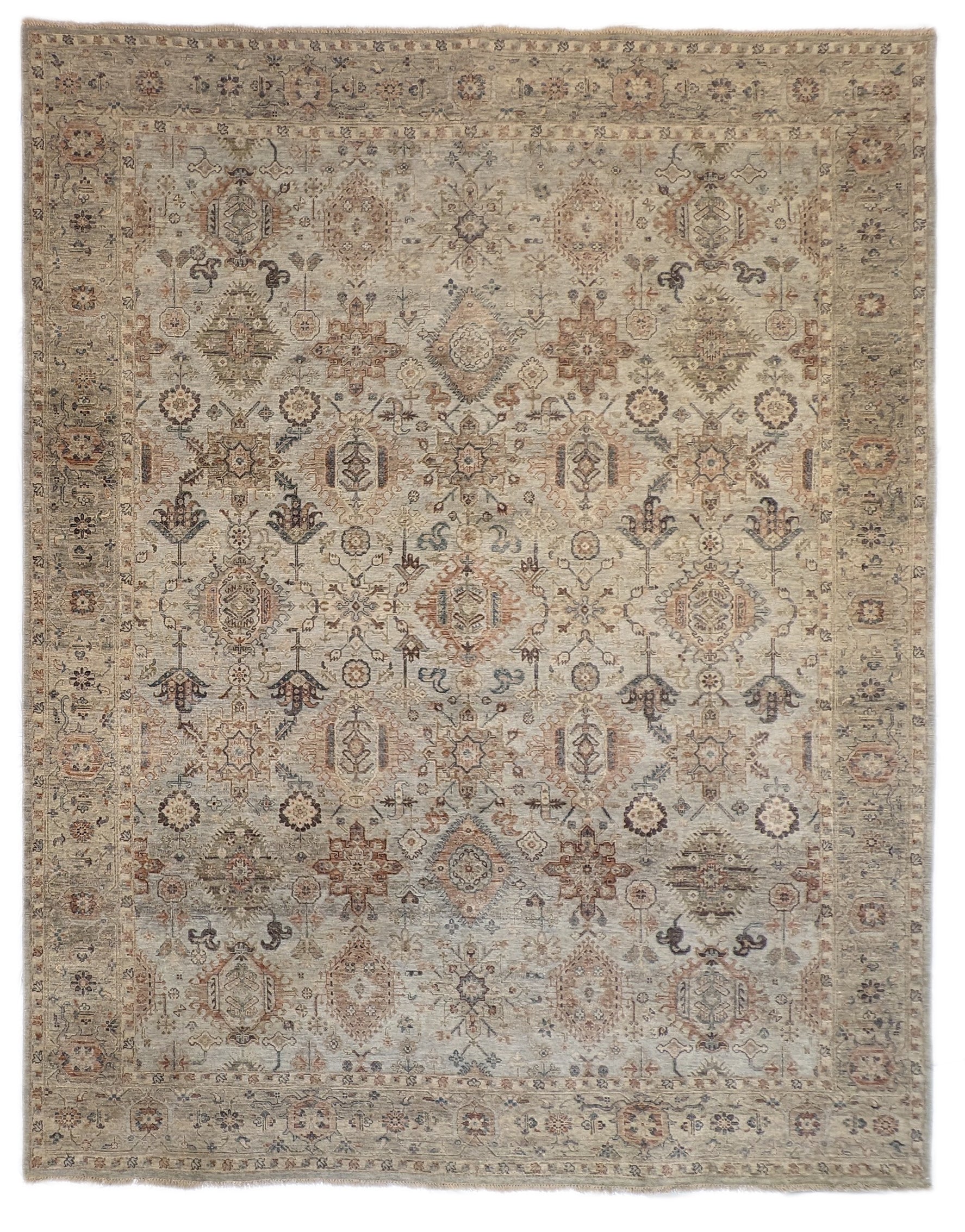 A hand-knotted wool rug with a traditional and coastal design in beige, blue, brown, and gold colors.