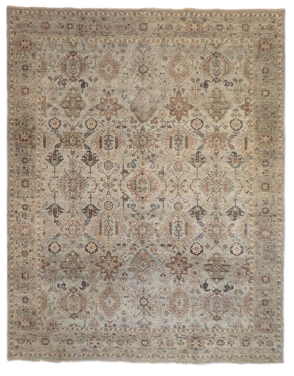 A hand-knotted wool rug with a traditional and coastal design in beige, blue, brown, and gold colors.