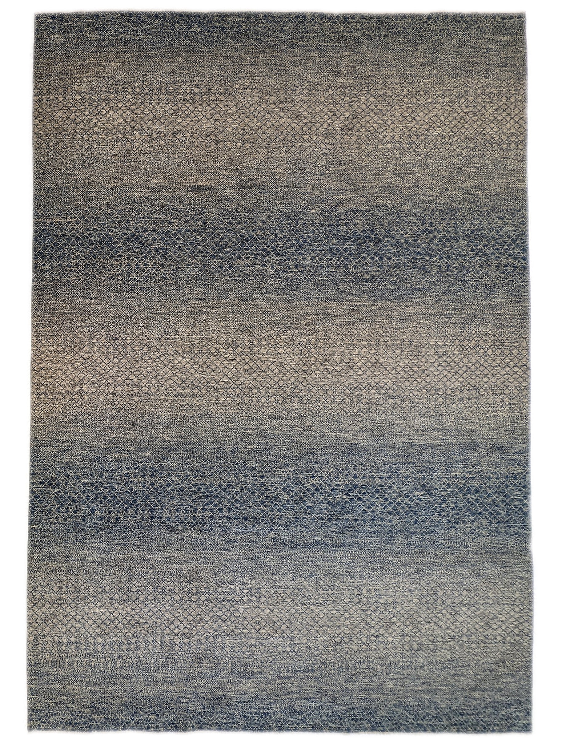 A hand-knotted wool rug with a net pattern in shades of beige, ivory, cream, and blue.