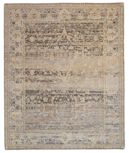 A handwoven rug with a beige and brown color palette with accents of yellow and faded blue, featuring geometric and floral patterns.