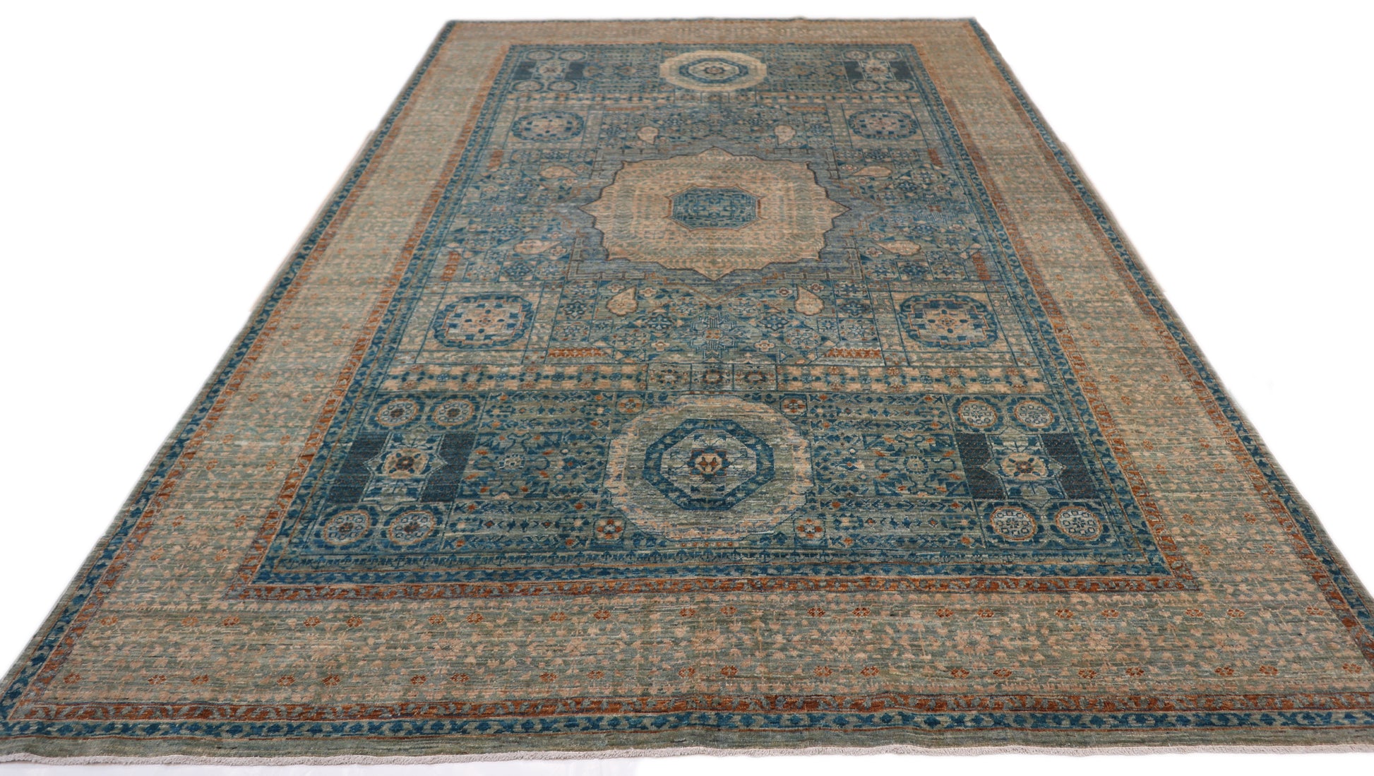 Hand-knotted Intricate patterned rug in lagoon blue and stormy teal with accents of sand, driftwood grey, and coral pink.