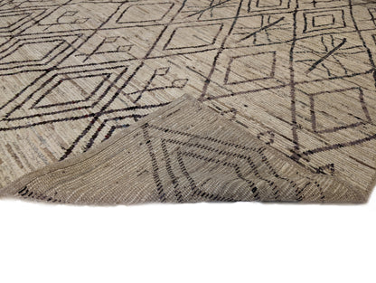A hand-knotted wool rug with a geometric pattern in natural tones of beige, brown, and gray. Cozy pile.