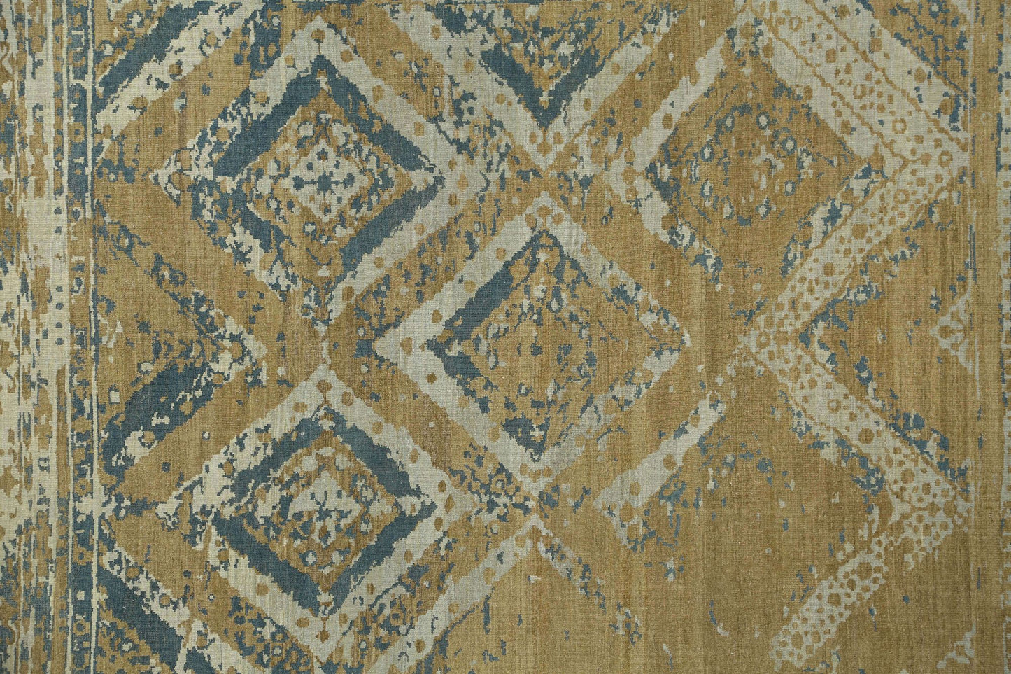 Hand-knotted rug with geometric transitional pattern in beige, blue, and brown. Low pile 
