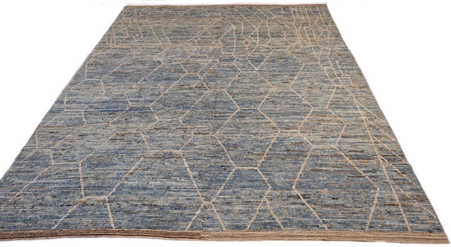 Hand-knotted geometric wool rug with a high pile and large knots in blue, ivory, beige, grey, and brown.
