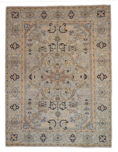 A hand-knotted wool rug with a coastal palette of beige, navy, rosy pink, blue, gold, and ivory colors, featuring intricate traditional and contemporary patterns.