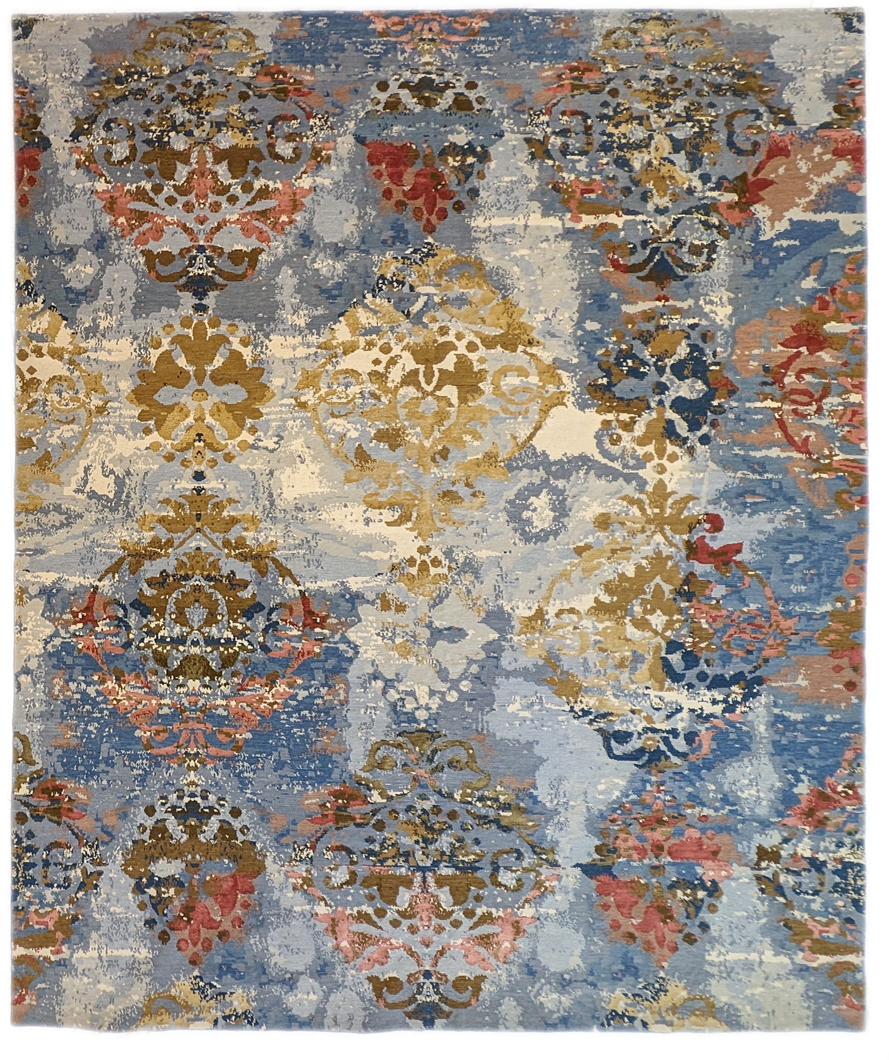 A hand-knotted rug with a luxurious blend of knots, featuring a palette of blues, salmon, ivory, brown, and gold. Wool and silk.