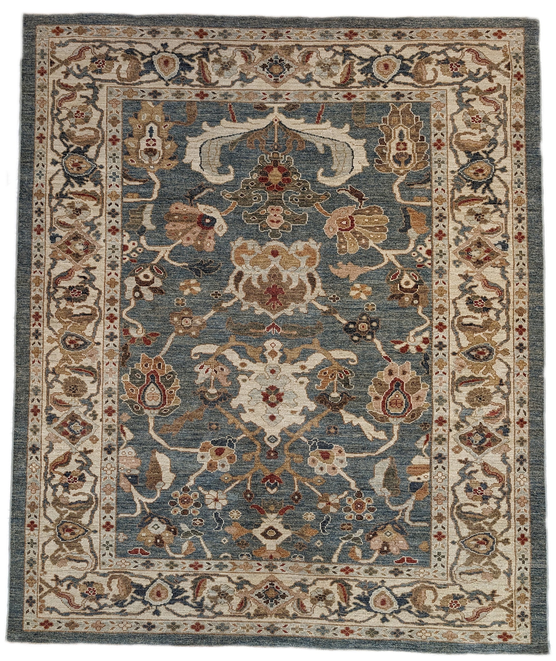 A hand-knotted wool rug with a traditional and contemporary design, featuring a luxurious color scheme of slate grey, red, gold, pink, blue, green, and beige. Low pile. 
