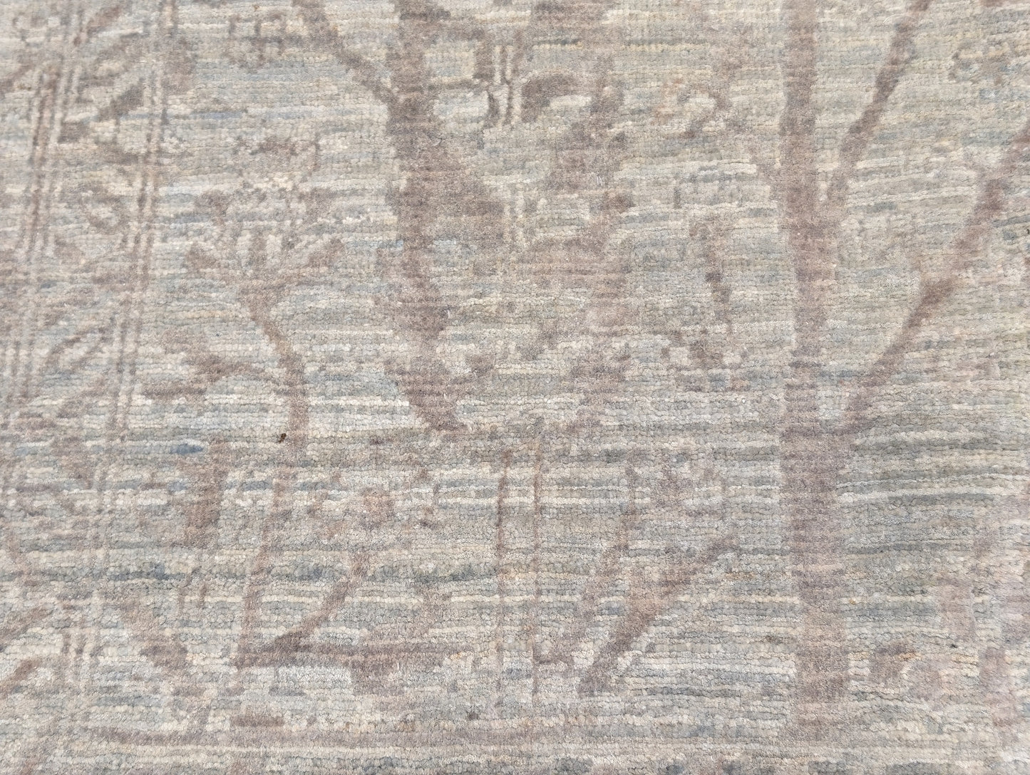 A beige hand-knotted rug, featuring a soft pink silk Tree of Life design and  lower pile height. 