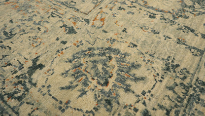 Hand- knotted decorative rug with a floral pattern in blue and beige tones 