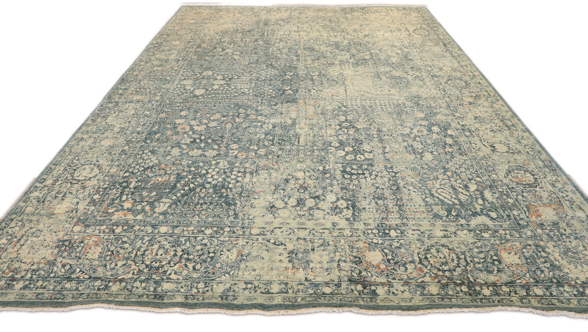 Hand- knotted decorative rug with a floral pattern in blue and beige tones 