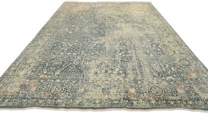 Hand- knotted decorative rug with a floral pattern in blue and beige tones 