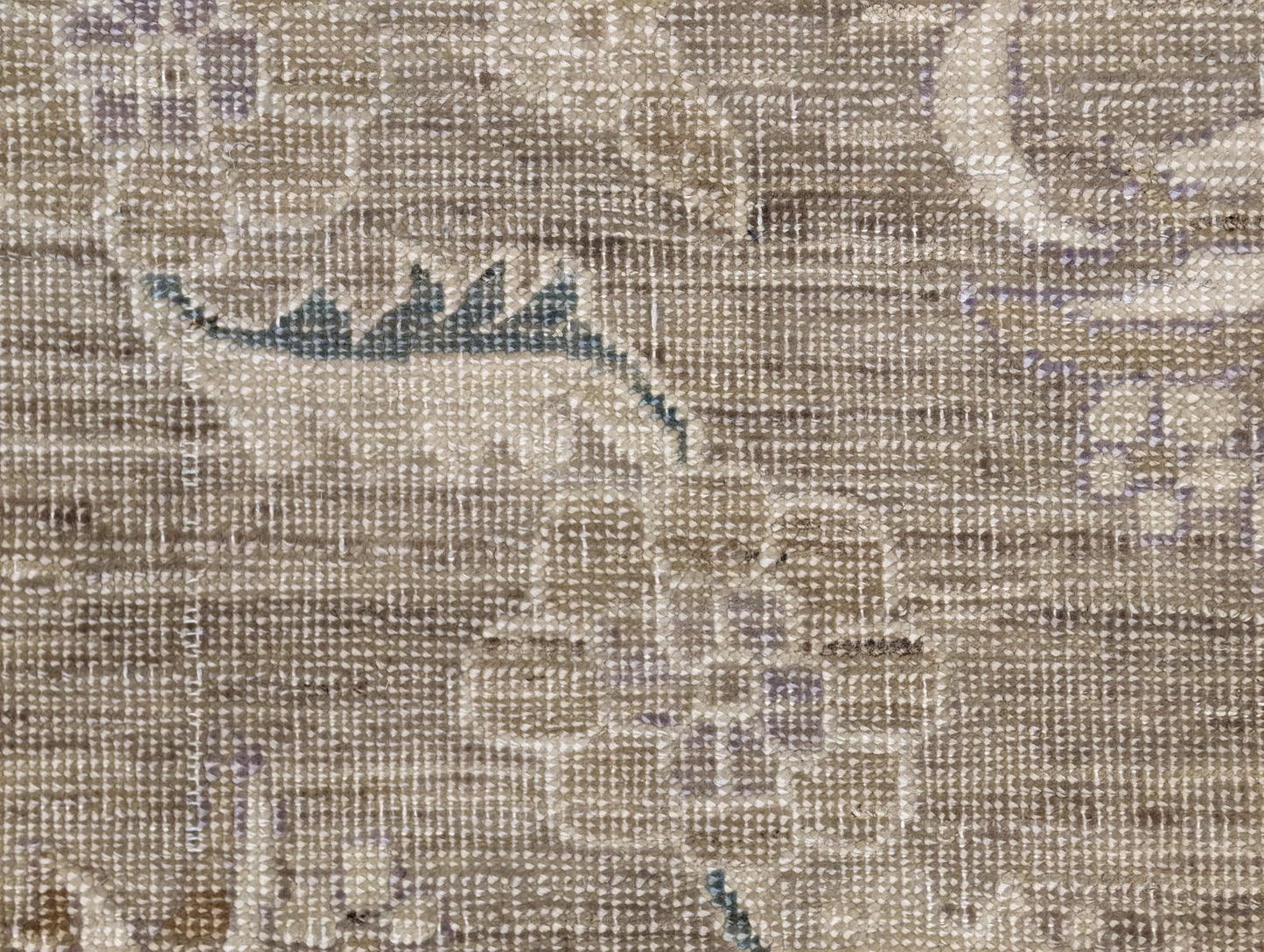 A hand-knotted wool rug with a traditional and coastal design in beige, brown, green, and other colors.